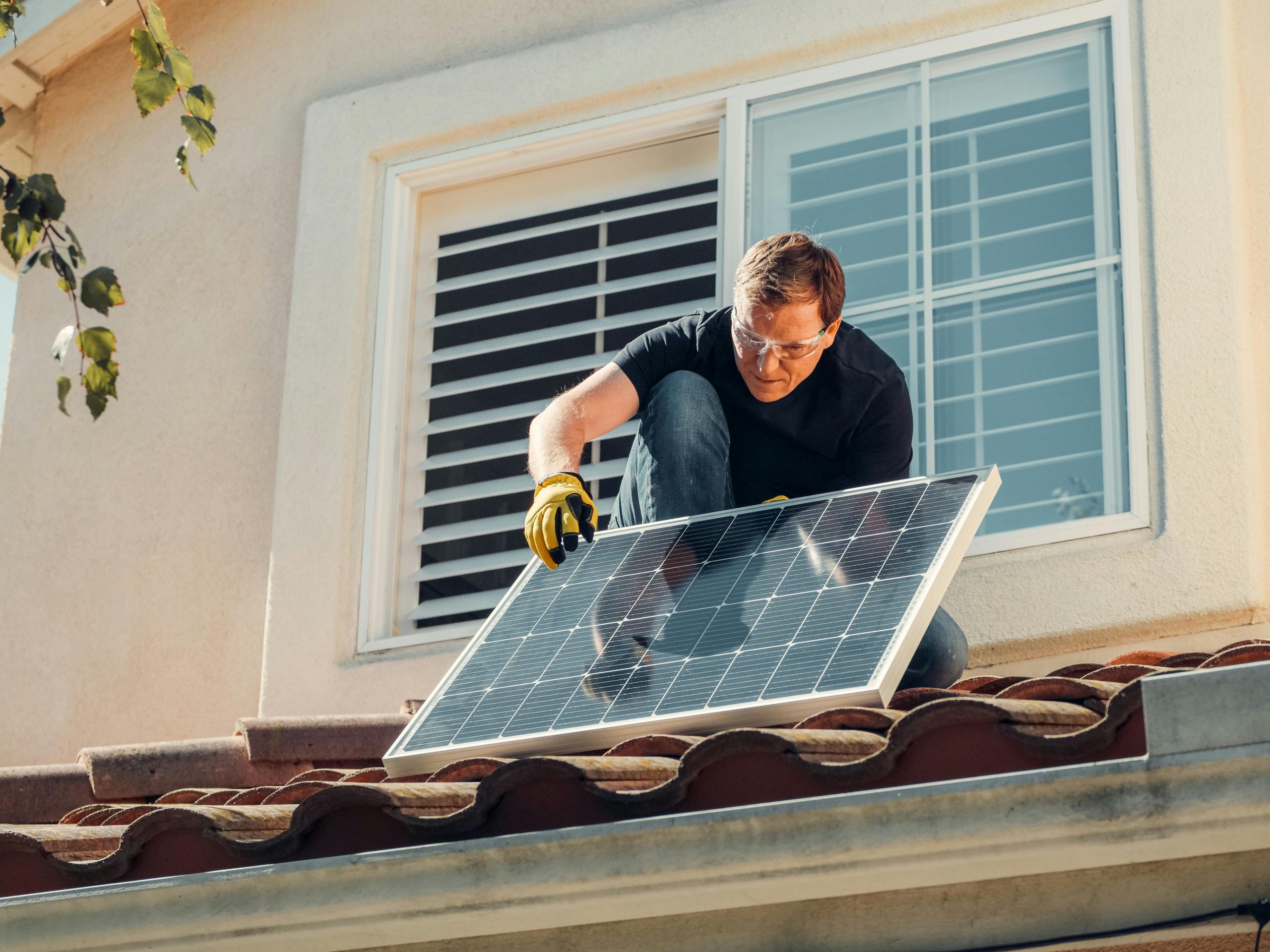 Man installing solar panel