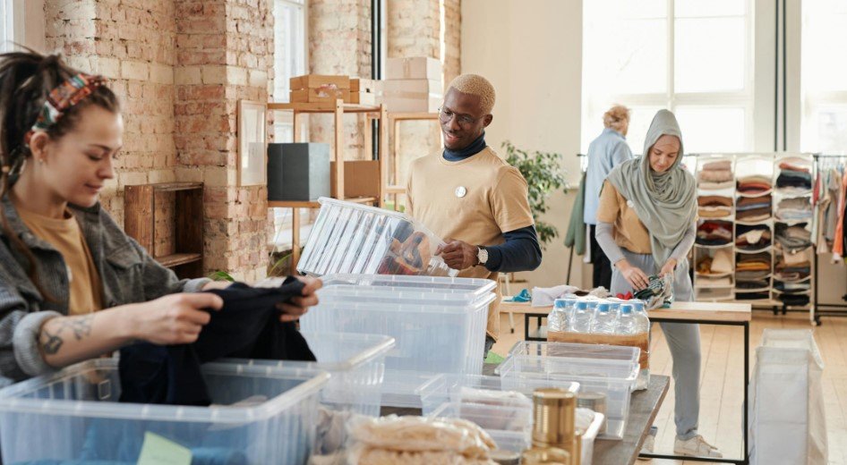 People in a Charity donation warehouse