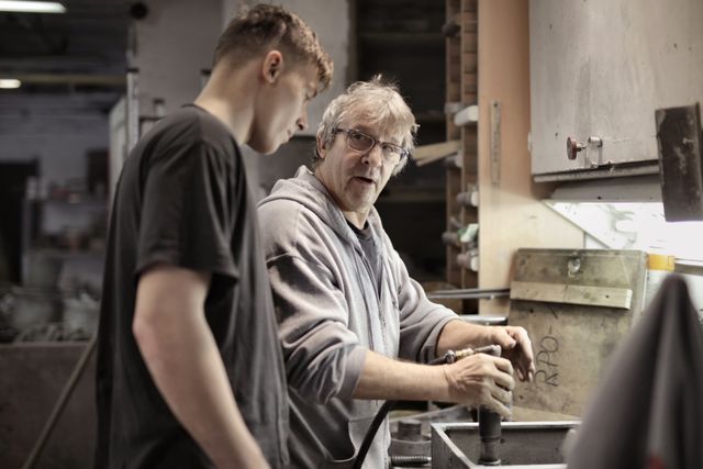 Apprentice at a workshop with a trainer.