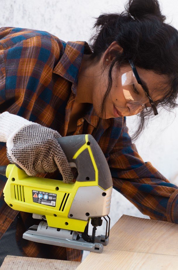 Young person at work with a woodcutter