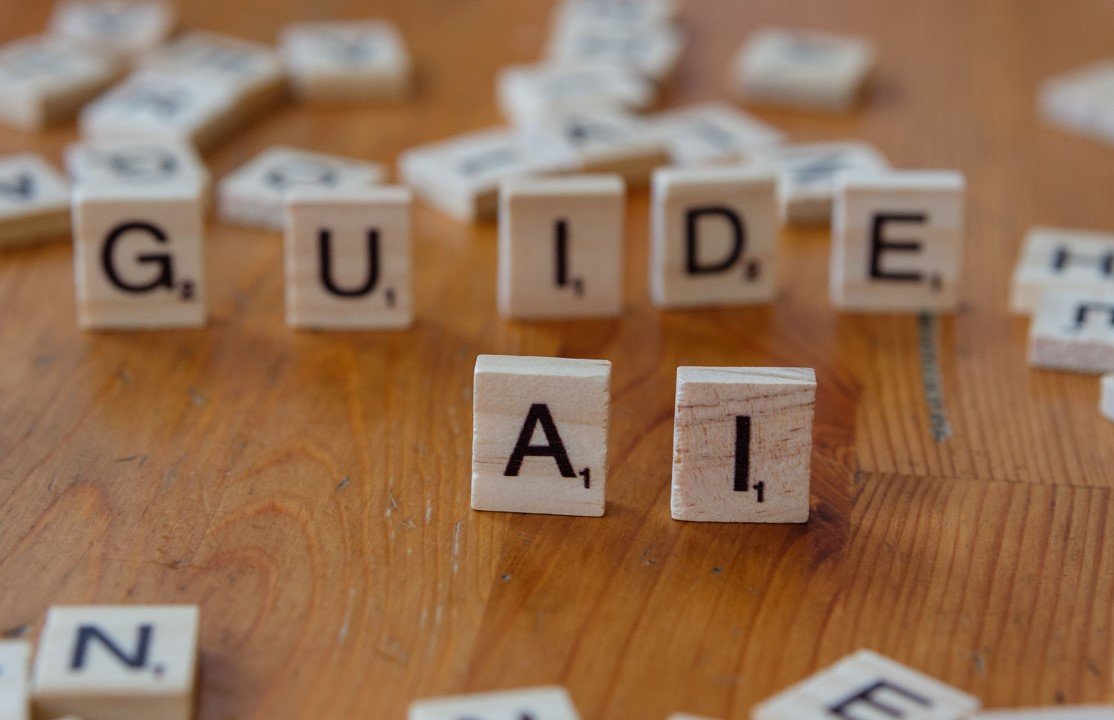 Guide AI spelled in letter blocks